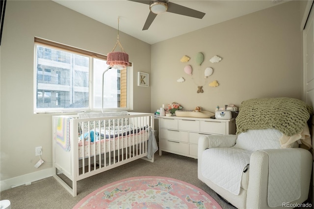 carpeted bedroom with ceiling fan