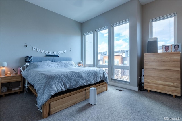 carpeted bedroom featuring access to outside