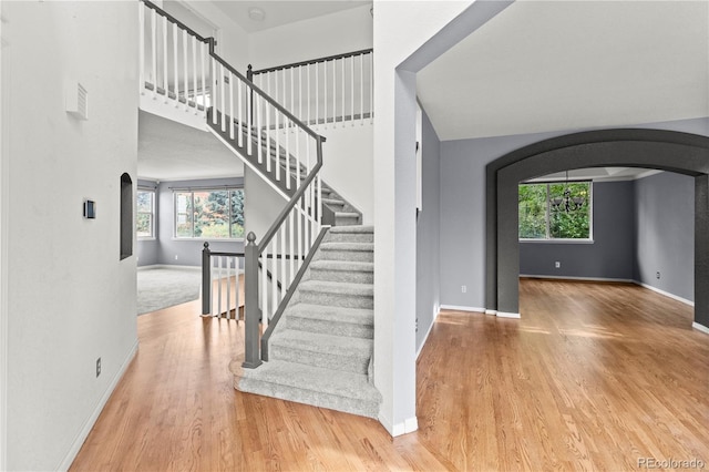 staircase featuring hardwood / wood-style floors