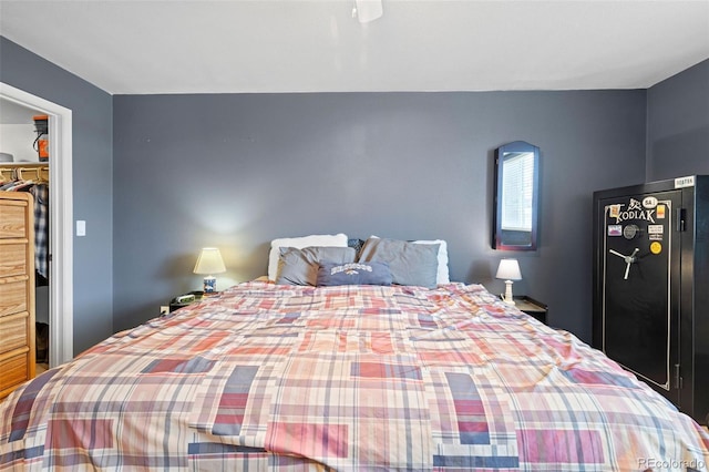 3021 S Ursula Cir Unit 102, Aurora, CO 80014 - bedroom featuring a walk in closet, a closet, and a ceiling fan