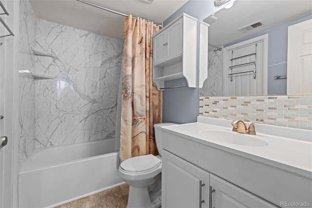 3021 S Ursula Cir Unit 102, Aurora, CO 80014 - full bathroom with backsplash, shower / bath combo, toilet, and vanity
