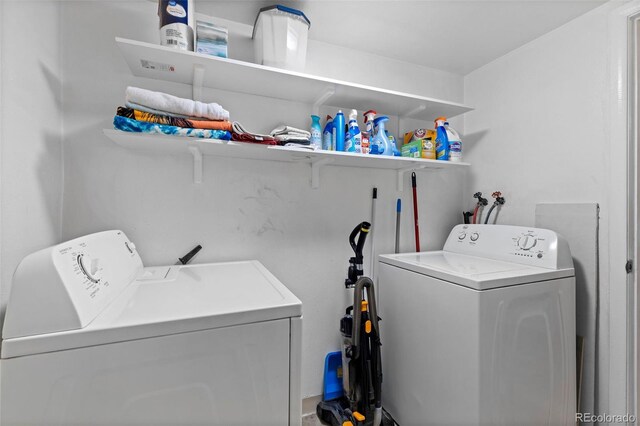 3021 S Ursula Cir Unit 102, Aurora, CO 80014 - clothes washing area featuring separate washer and dryer