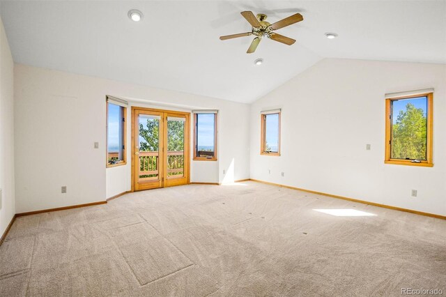 unfurnished living room featuring light carpet, ceiling fan, and lofted ceiling