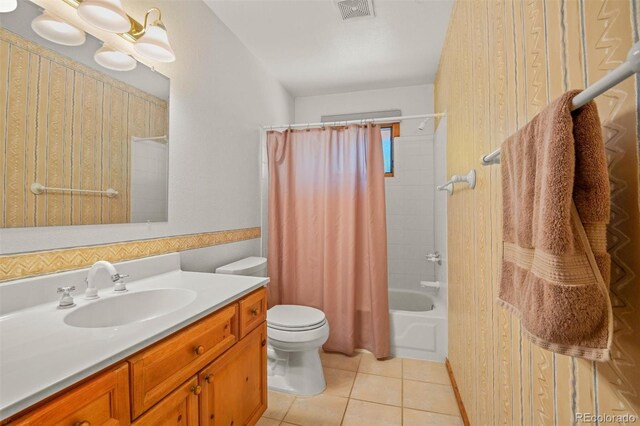 full bathroom with toilet, vanity, tile patterned floors, and shower / bathtub combination with curtain