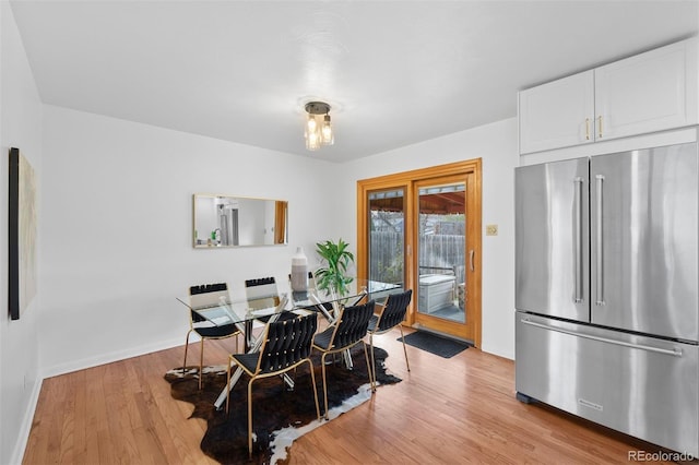 1325 S Grape St, Denver, CO 80222 - dining room featuring light wood finished floors and baseboards