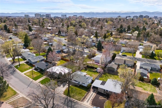 1325 S Grape St, Denver, CO 80222 - aerial overview of property's location featuring mountains and nearby suburban area