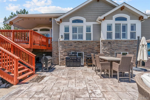 9576 E 147th Pl, Brighton, CO 80602 - view of patio / terrace with a grill, outdoor dining space, and a deck