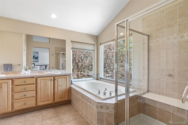 9576 E 147th Pl, Brighton, CO 80602 - full bathroom with double vanity, a stall shower, a bath, tile patterned floors, and lofted ceiling