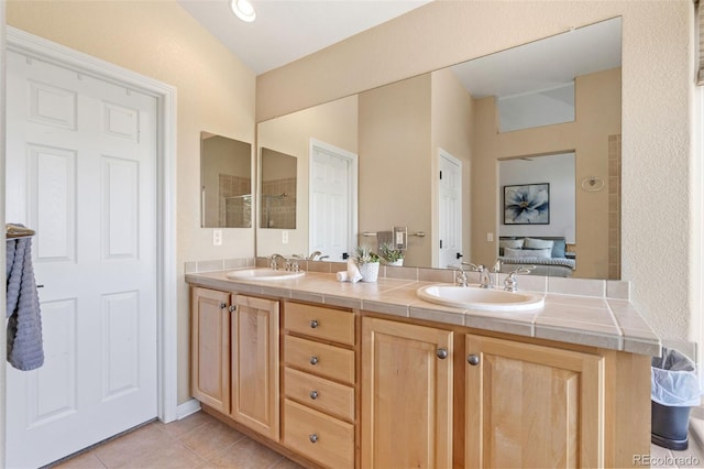 9576 E 147th Pl, Brighton, CO 80602 - full bathroom with double vanity, tile patterned floors, and a shower