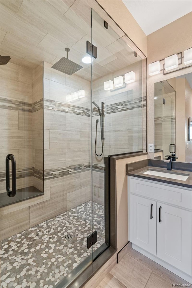 9576 E 147th Pl, Brighton, CO 80602 - bathroom featuring a shower stall and vanity
