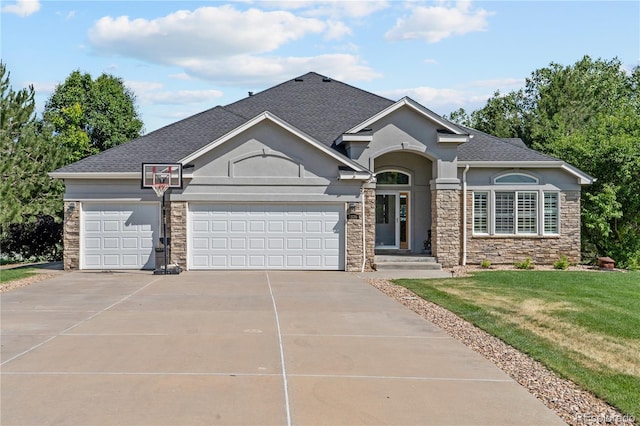 9576 E 147th Pl, Brighton, CO 80602 - view of front of house featuring stone siding, concrete driveway, an attached garage, a shingled roof, and a front yard