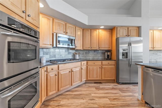 9576 E 147th Pl, Brighton, CO 80602 - kitchen with appliances with stainless steel finishes, light brown cabinets, dark countertops, tasteful backsplash, and recessed lighting