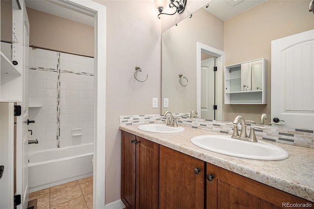 bathroom with tasteful backsplash, tile patterned floors, vanity, and bathtub / shower combination