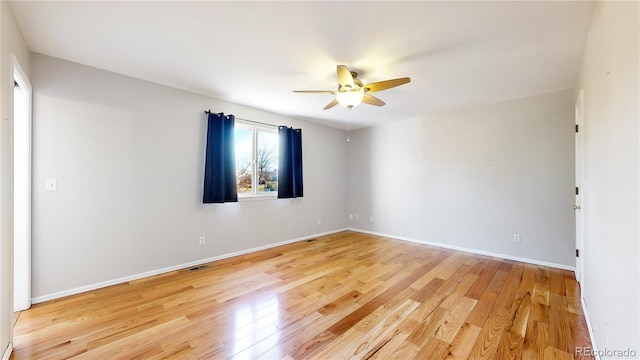 spare room with ceiling fan and light hardwood / wood-style floors