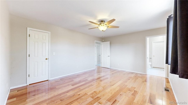 spare room with light hardwood / wood-style flooring and ceiling fan