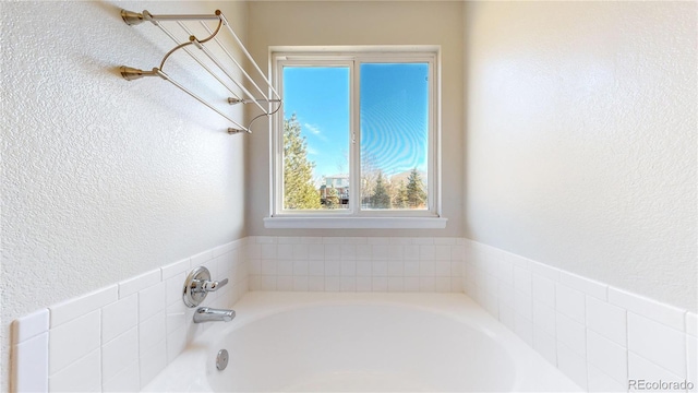 bathroom featuring a washtub