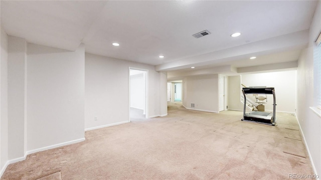 unfurnished living room with light carpet