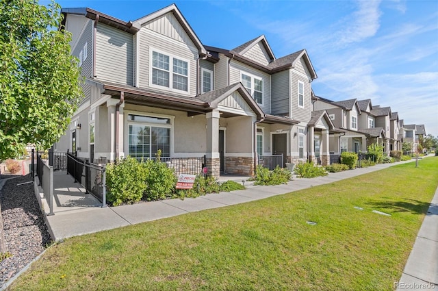 view of front of property with a front yard, a porch, and central air condition unit