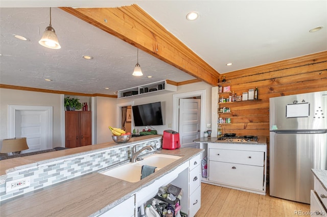 835 N Union Blvd, Colorado Springs, CO 80909 - kitchen featuring appliances with stainless steel finishes, white cabinetry, light wood-style flooring, hanging light fixtures, and recessed lighting