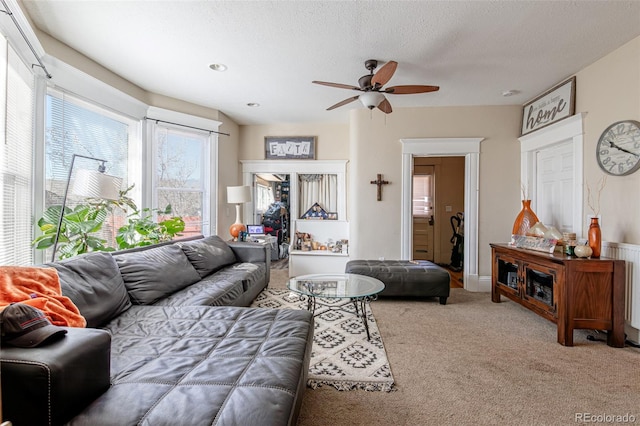 835 N Union Blvd, Colorado Springs, CO 80909 - living room featuring ceiling fan, carpet flooring, and a textured ceiling
