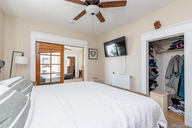 835 N Union Blvd, Colorado Springs, CO 80909 - bedroom with radiator, a closet, ceiling fan, and wood finished floors