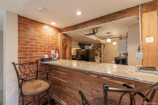 835 N Union Blvd, Colorado Springs, CO 80909 - indoor dry bar with freestanding refrigerator, under cabinet range hood, and beam ceiling