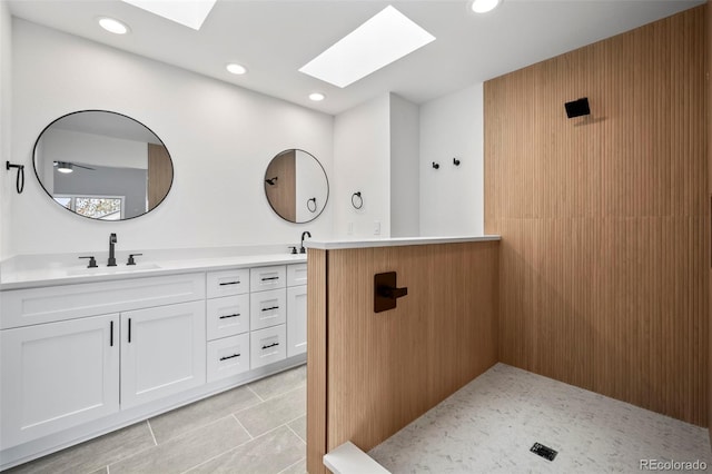 bathroom with vanity and a skylight