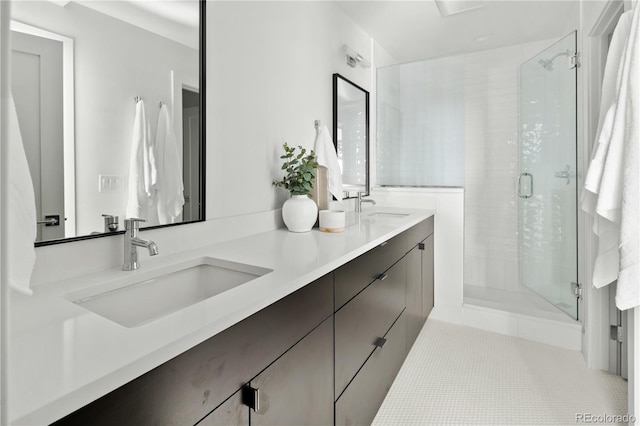 bathroom featuring vanity, an enclosed shower, and tile patterned floors