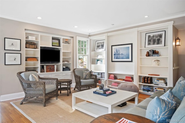 living room with hardwood / wood-style flooring and ornamental molding