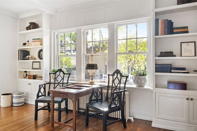 141 N Gilpin St, Denver, CO 80218 - dining room with ornamental molding, dark wood finished floors, built in features, and healthy amount of natural light