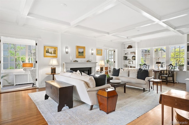 141 N Gilpin St, Denver, CO 80218 - living area featuring radiator heating unit, coffered ceiling, plenty of natural light, beamed ceiling, and wood finished floors