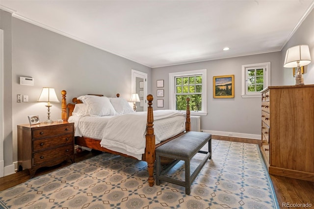 141 N Gilpin St, Denver, CO 80218 - bedroom with radiator, dark wood finished floors, crown molding, and recessed lighting