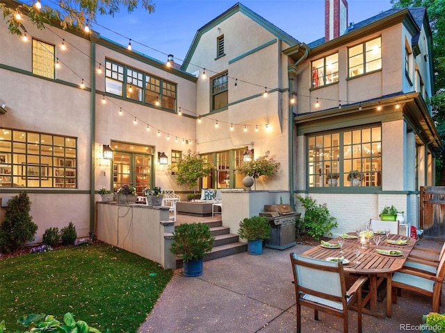 141 N Gilpin St, Denver, CO 80218 - back of house with stucco siding, a patio area, a chimney, and brick siding