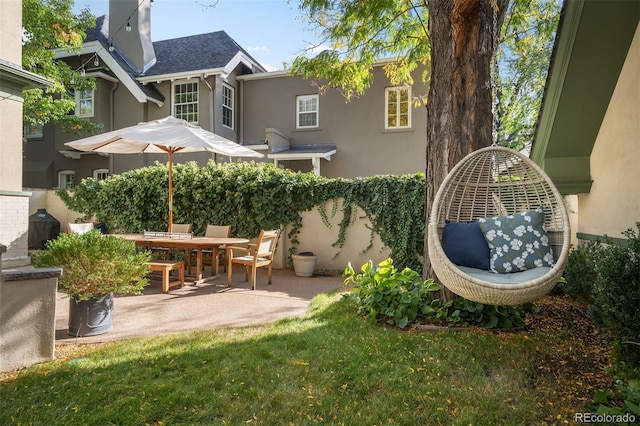 141 N Gilpin St, Denver, CO 80218 - rear view of house featuring stucco siding, a patio, and a shingled roof