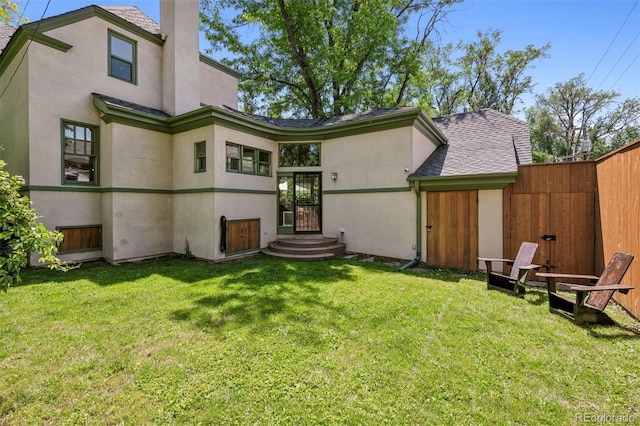 141 N Gilpin St, Denver, CO 80218 - rear view of property with stucco siding and a chimney