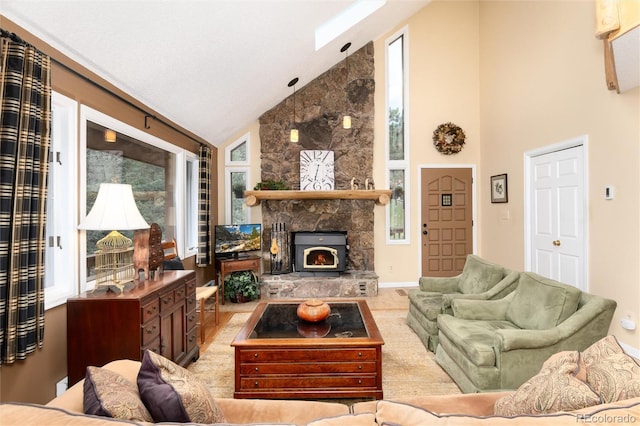 31673 Ponderosa Way, Evergreen, CO 80439 - living area featuring high vaulted ceiling, a fireplace, and plenty of natural light