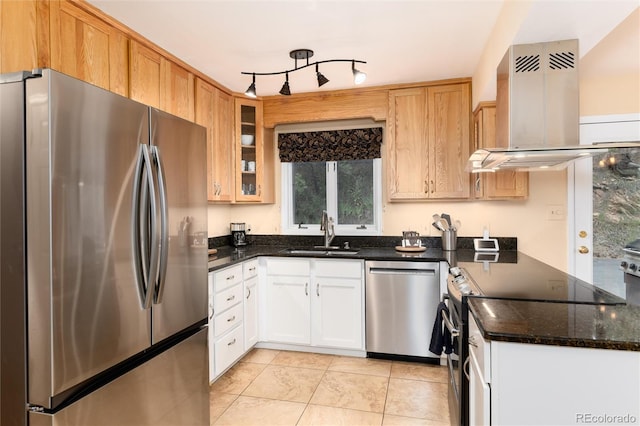 31673 Ponderosa Way, Evergreen, CO 80439 - kitchen with appliances with stainless steel finishes, ventilation hood, light tile patterned floors, glass insert cabinets, and dark stone counters