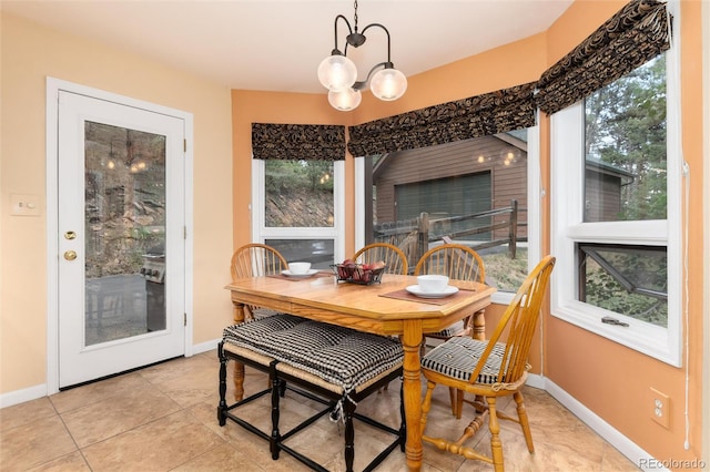 31673 Ponderosa Way, Evergreen, CO 80439 - dining room featuring light tile patterned floors and a fireplace