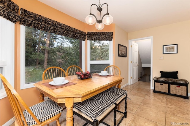 31673 Ponderosa Way, Evergreen, CO 80439 - dining space featuring a chandelier and light tile patterned flooring