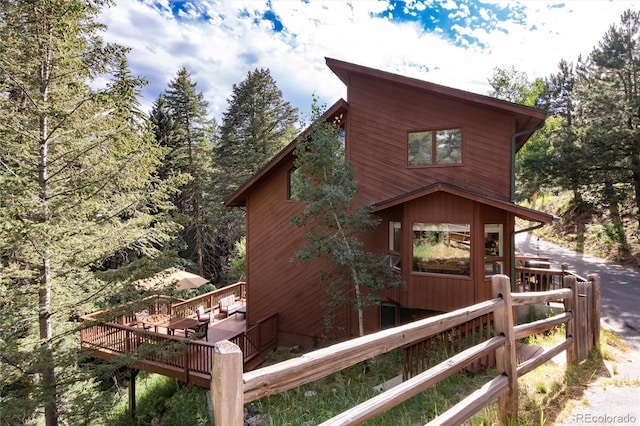 31673 Ponderosa Way, Evergreen, CO 80439 - view of side of property featuring a wooden deck