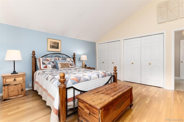 31673 Ponderosa Way, Evergreen, CO 80439 - bedroom with vaulted ceiling, light wood-type flooring, and multiple closets