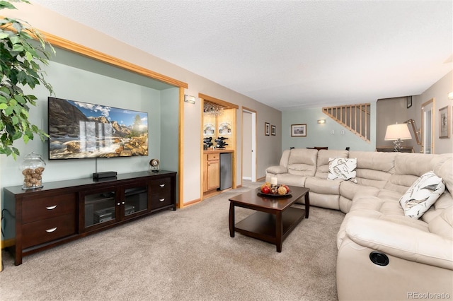 31673 Ponderosa Way, Evergreen, CO 80439 - carpeted living room with a textured ceiling and stairs