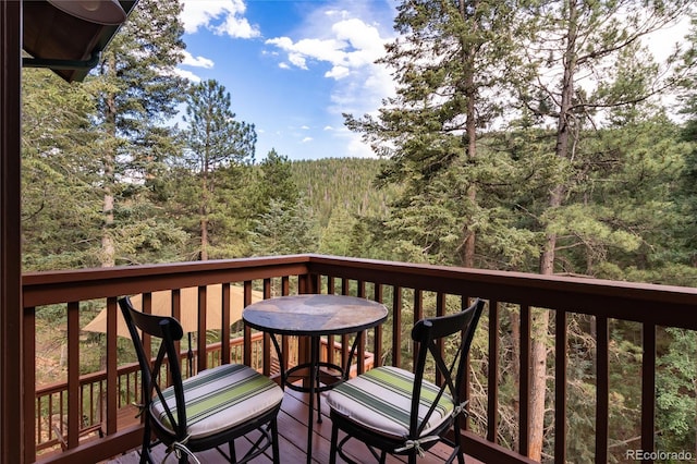 31673 Ponderosa Way, Evergreen, CO 80439 - deck featuring a wooded view