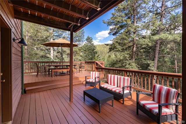 31673 Ponderosa Way, Evergreen, CO 80439 - deck featuring an outdoor living space and outdoor dining space