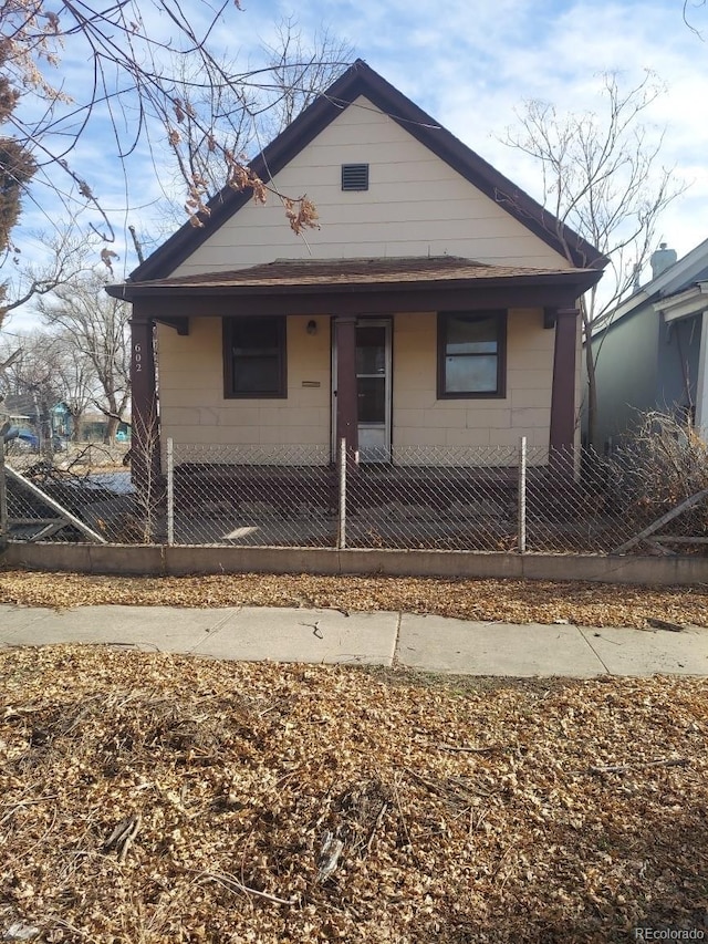 bungalow-style house featuring a fenced front yard