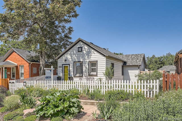 4883 Perry St, Denver, CO 80212 - bungalow-style home featuring a fenced front yard and roof with shingles
