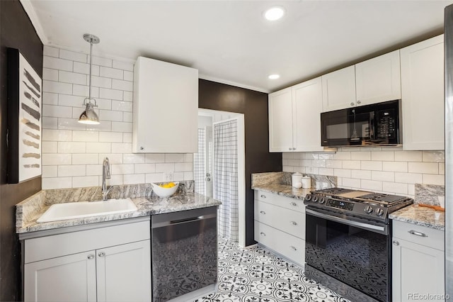 4883 Perry St, Denver, CO 80212 - kitchen featuring appliances with stainless steel finishes, white cabinets, backsplash, light stone counters, and recessed lighting