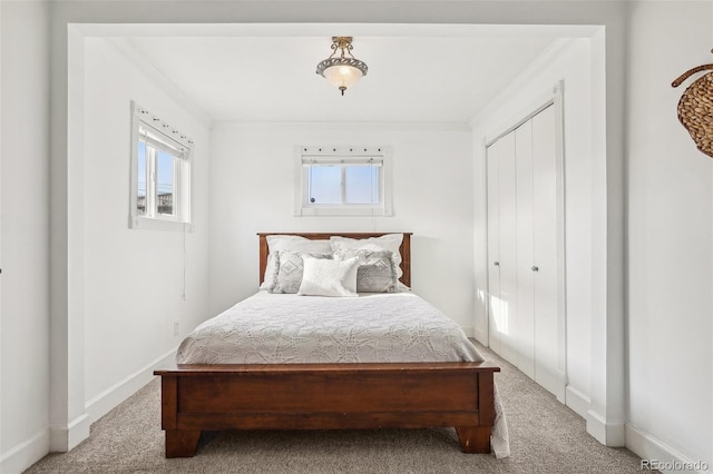 4883 Perry St, Denver, CO 80212 - carpeted bedroom with multiple windows, a closet, and ornamental molding