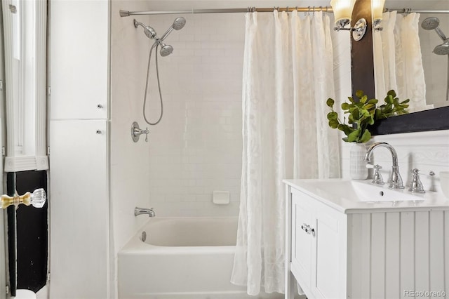 4883 Perry St, Denver, CO 80212 - full bathroom featuring shower / bath combo with shower curtain, vanity, and tasteful backsplash