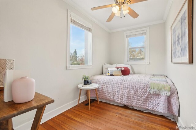 4883 Perry St, Denver, CO 80212 - bedroom with crown molding, wood finished floors, multiple windows, and a ceiling fan
